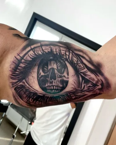 Big Eyes Bicep Tattoo For Men