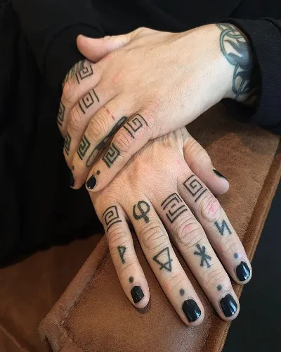 Black Ink Tattoos on Fingers