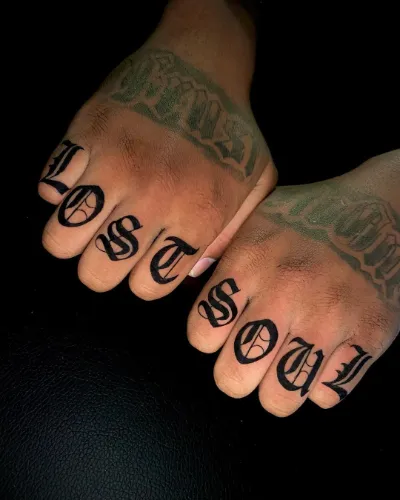 Bold Font Finger Tattoo