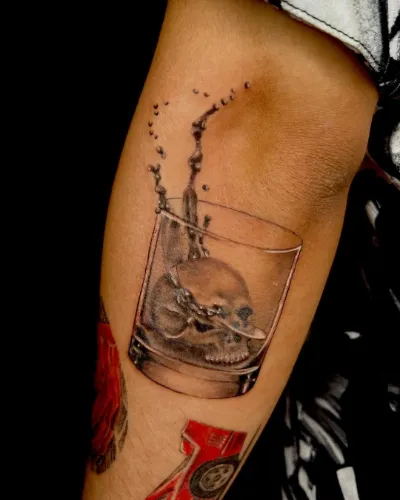 Skull In Glass Arm Tattoo
