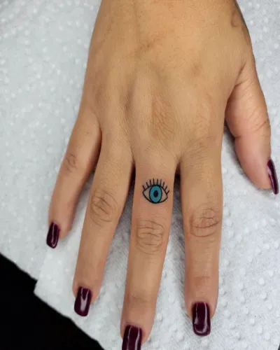 Evil Eye Finger Tattoo For Girls