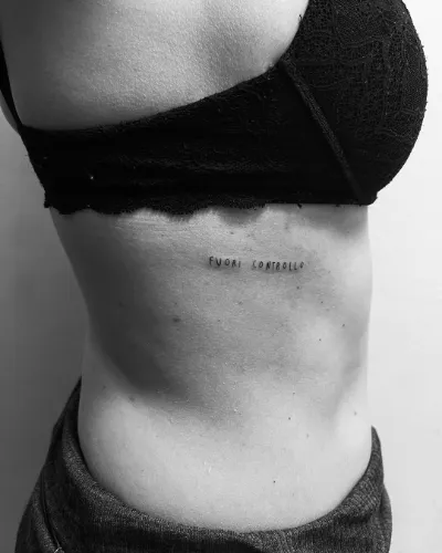 Quote on Ribs Tattoo women