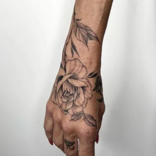 Ravishing rose hand tattoo
