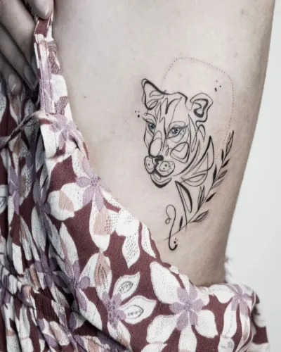 Small Lion Chest Tattoo