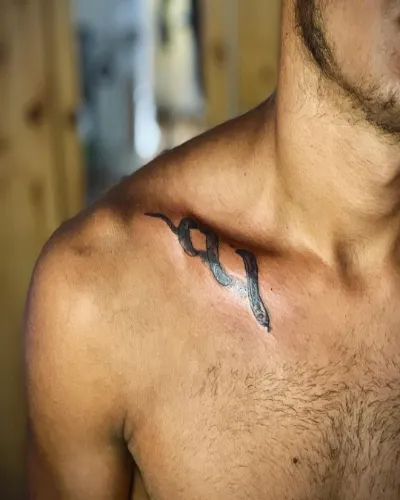 Small Snake Chest Tattoo