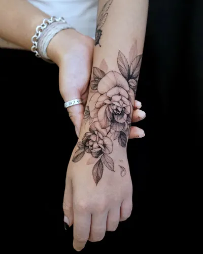 Trendy Floral hand tattoo