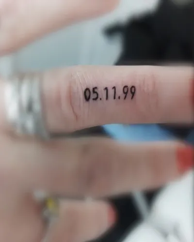 Wedding Date On Finger Tattoo