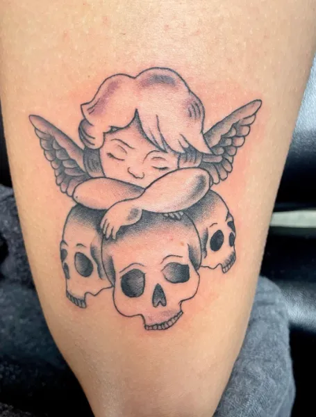 Above Knee Skull Tattoo