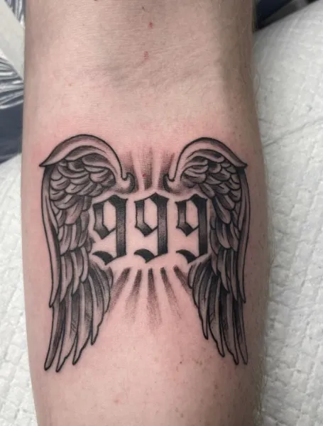 999 Forearm Tattoo