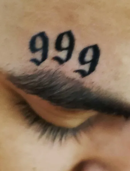 999 Forehead Tattoo Design