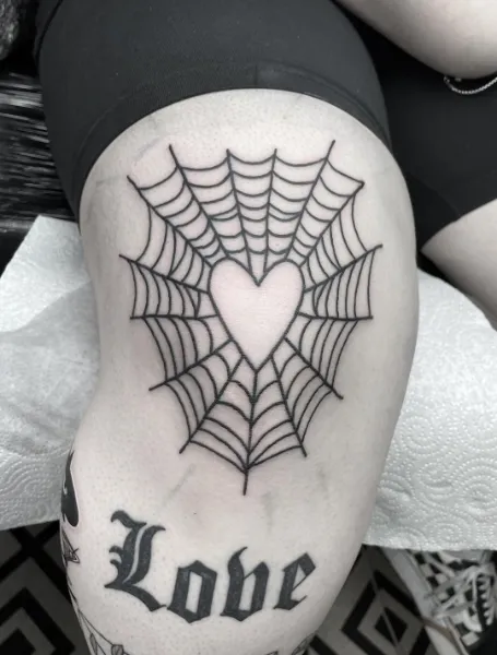 Tattoo Of Spider Web Above Knee