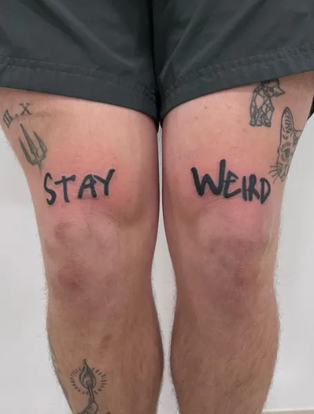 Two-Words Above Knee Tattoo Idea